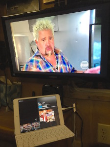 The iPad on the nightstand - streaming live TV (via Sling) to big screen over the bed.