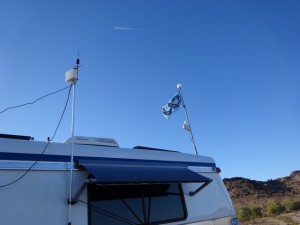Two flagpoles setup as antenna mounts. 