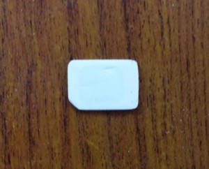 Figure 7: My SIM after completing sanding. The numbers are gone entirely and you can begin to make out the outline of the actual chip through the plastic.